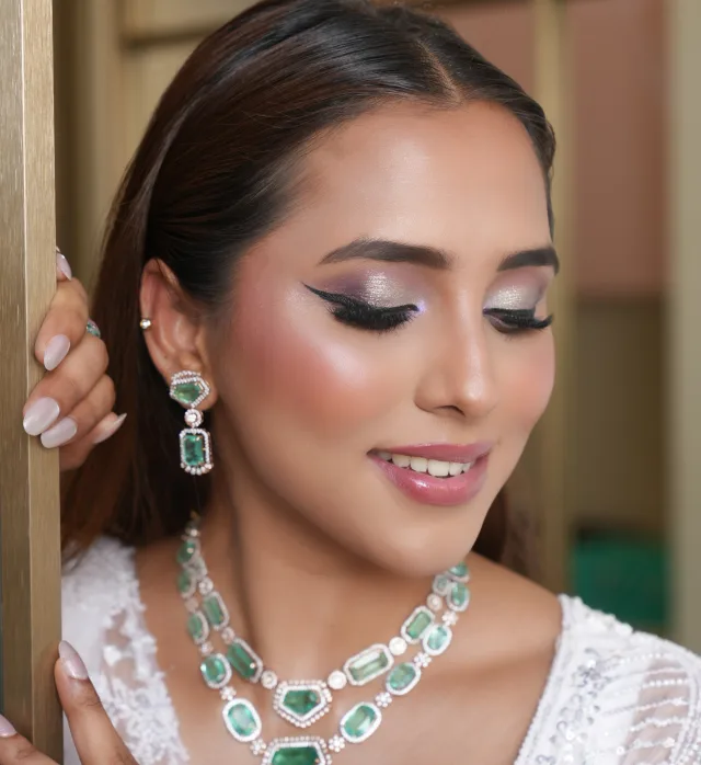 Contemporary sangeet look with shimmering eye makeup and rose undertones