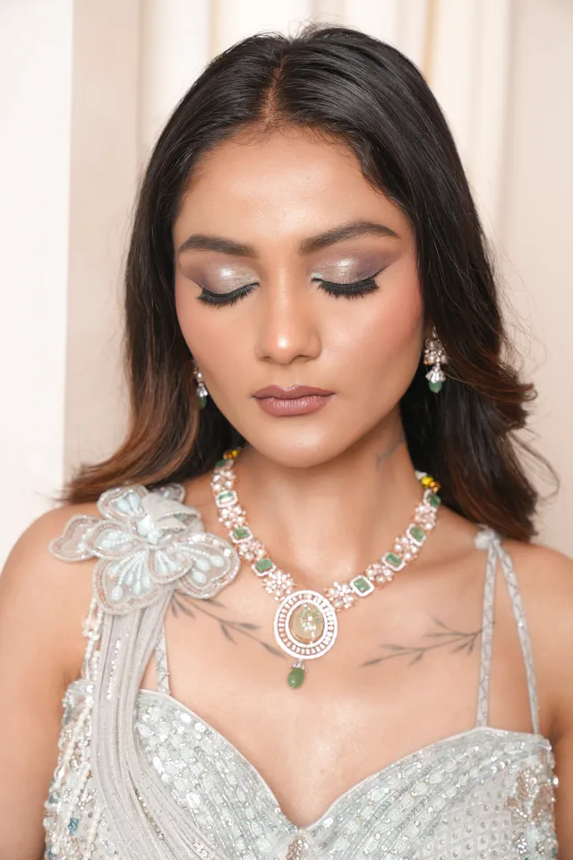Golden hour engagement look highlighting micro-shimmer base and lush lashes