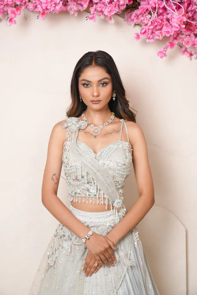 Radiant sangeet bridal makeup with defined kohled eyes and warm terracotta lips